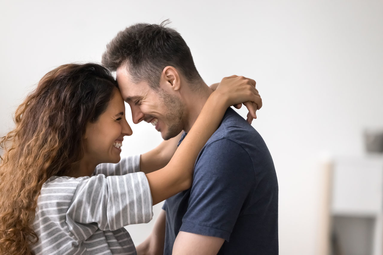 Close up side view beautiful Hispanic loving couple, embracing, enjoy moment of tenderness and strong emotional connection. Affection, understanding, and support in relationship. Fist date and love